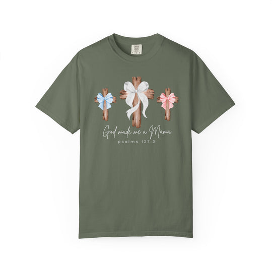 God Made Me a Mama Tee: Olive-toned T-shirt with wooden crosses and bows, featuring script text 'God made me a Mama' and 'Psalms 127:3' underneath.