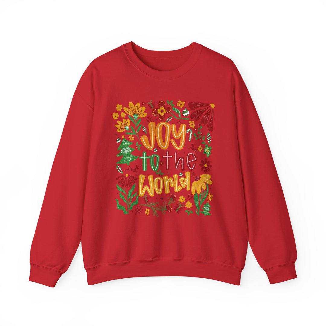 Red crew-neck sweatshirt with Joy to the World in stylized lettering, surrounded by festive holiday illustrations like holly, candy canes, and ornaments. Cozy, durable, unisex design.