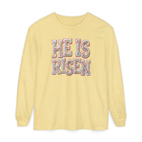 He is Risen Long Sleeve Tee featuring pastel floral lettering on pale yellow, made of 100% ring-spun cotton for a soft, relaxed fit.