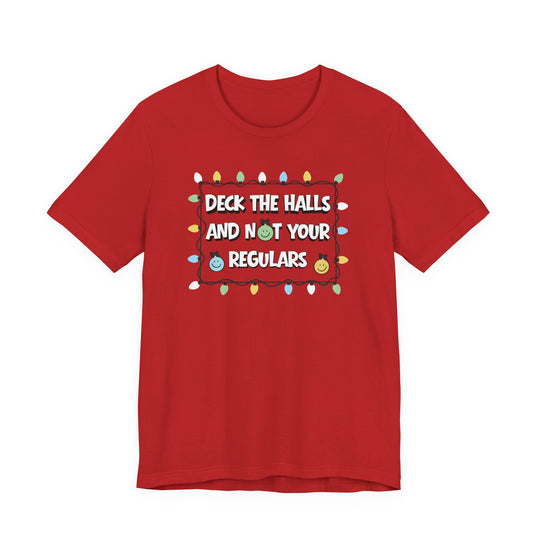 Red Regulars Tee with Christmas lights frame and humorous text, featuring smiling ornaments. Classic unisex fit with soft cotton and ribbed knit collars.