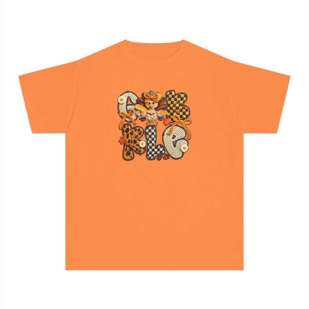 Gobble Kids Tee features a bright orange design with fall-themed crochet-style letters, daisy-like flowers, and a turkey motif, perfect for active kids' comfort and style.