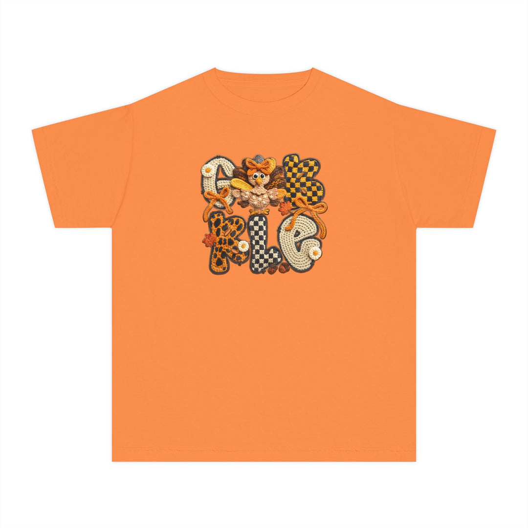 Gobble Kids Tee features a bright orange design with fall-themed crochet-style letters, daisy-like flowers, and a turkey motif, perfect for active kids' comfort and style.
