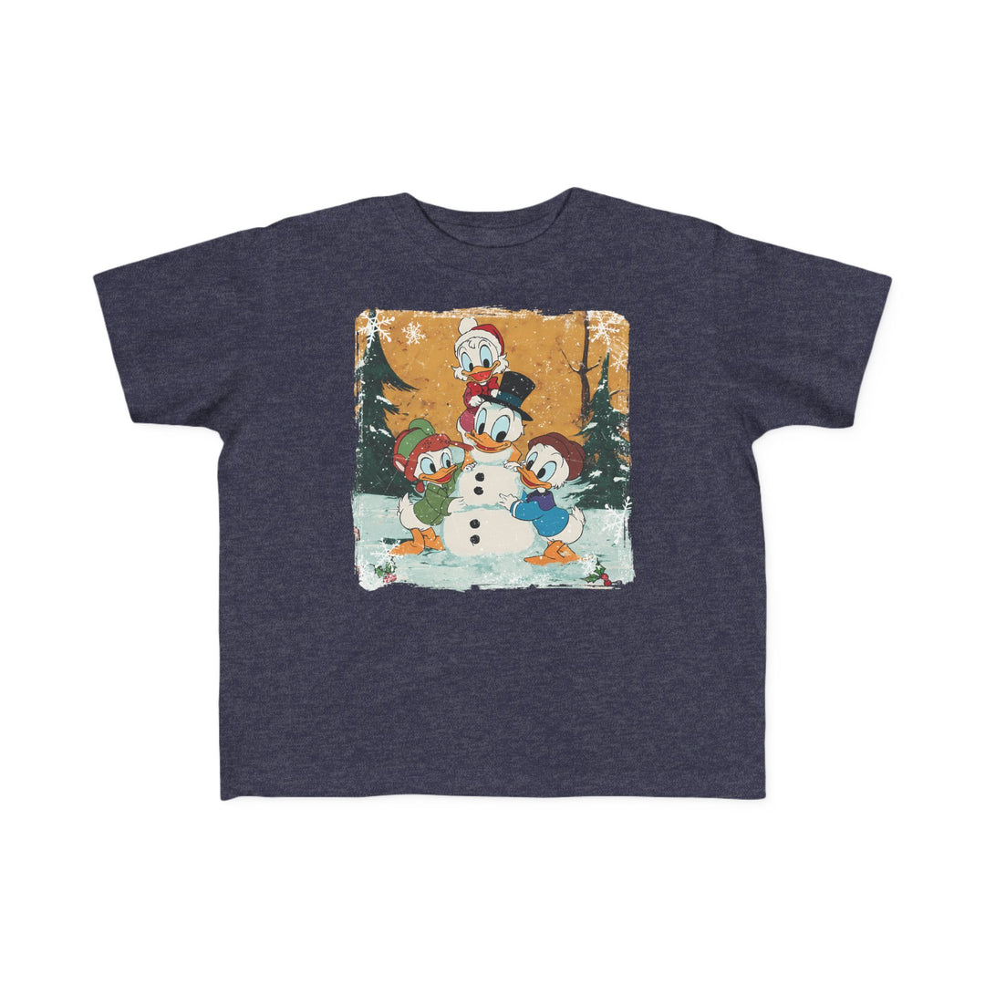 Duck Snowmen Toddler Tee features Donald Duck and nephews building a snowman in a winter scene, printed on a soft, navy T-shirt for toddlers.