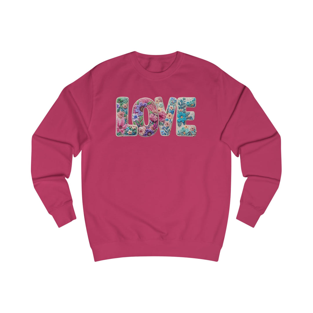 Magenta crewneck sweatshirt with LOVE in floral letters, offering a stylish fit and soft cotton blend, perfect from Faith Family Designs' unique graphic apparel collection.