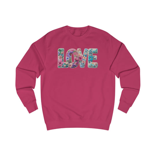 Magenta crewneck sweatshirt with LOVE in floral letters, offering a stylish fit and soft cotton blend, perfect from Faith Family Designs' unique graphic apparel collection.