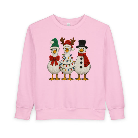 Light-pink Christmas Geese Toddler Crew with festive waterfowl graphic, featuring Santa hat, reindeer antlers, and snowman costume, ensuring warmth and comfort for toddlers.