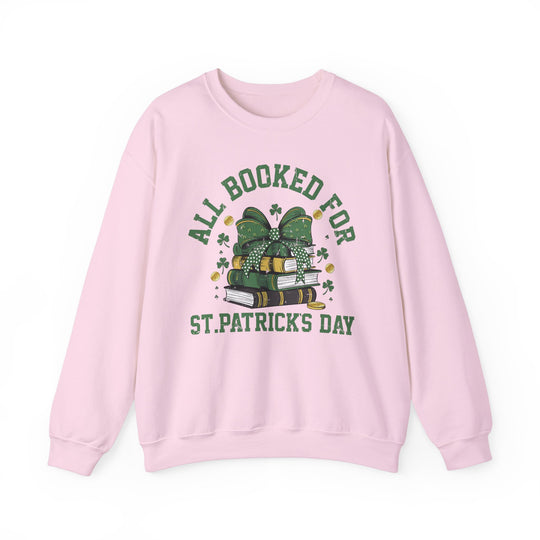 Booked Up for St. Patrick's Day Crew: Pink sweatshirt with green text, unisex, comfortable blend, ribbed collar, no side seams, true to size, medium-heavy fabric.