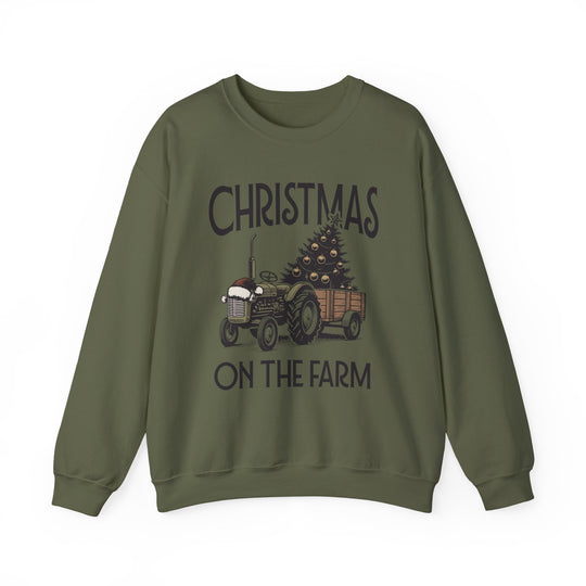 Green crewneck sweatshirt featuring a vintage tractor with a Christmas tree, labeled CHRISTMAS ON THE FARM, from Faith Family Designs' unique graphic t-shirt collection.