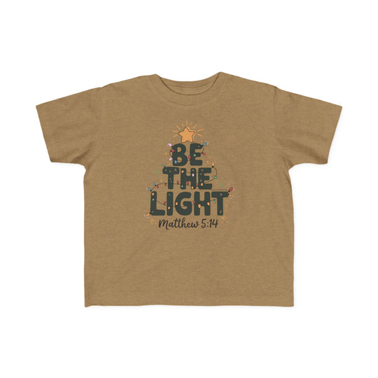 Be the Light Toddler Tee featuring a holiday-themed graphic with BE THE LIGHT, colored lights, a star, and Matthew 5:14, perfect for sensitive toddler skin.