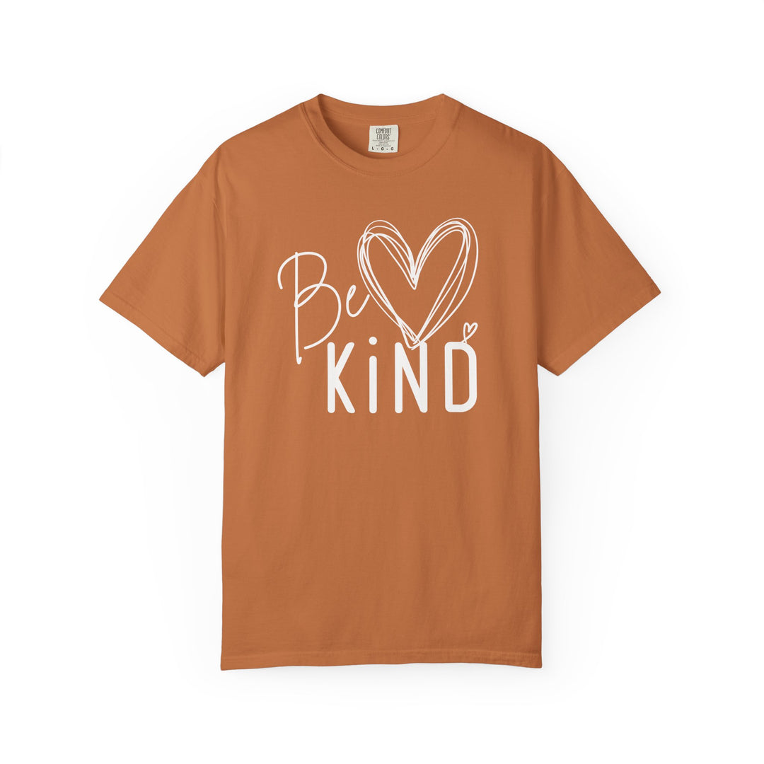 Unisex Be Kind Tee with cursive and block lettering, featuring a sketched heart. Relaxed fit, 80% ring-spun cotton, Comfort Colors label.