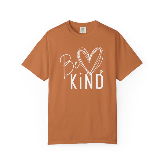 Unisex Be Kind Tee with cursive and block lettering, featuring a sketched heart. Relaxed fit, 80% ring-spun cotton, Comfort Colors label.