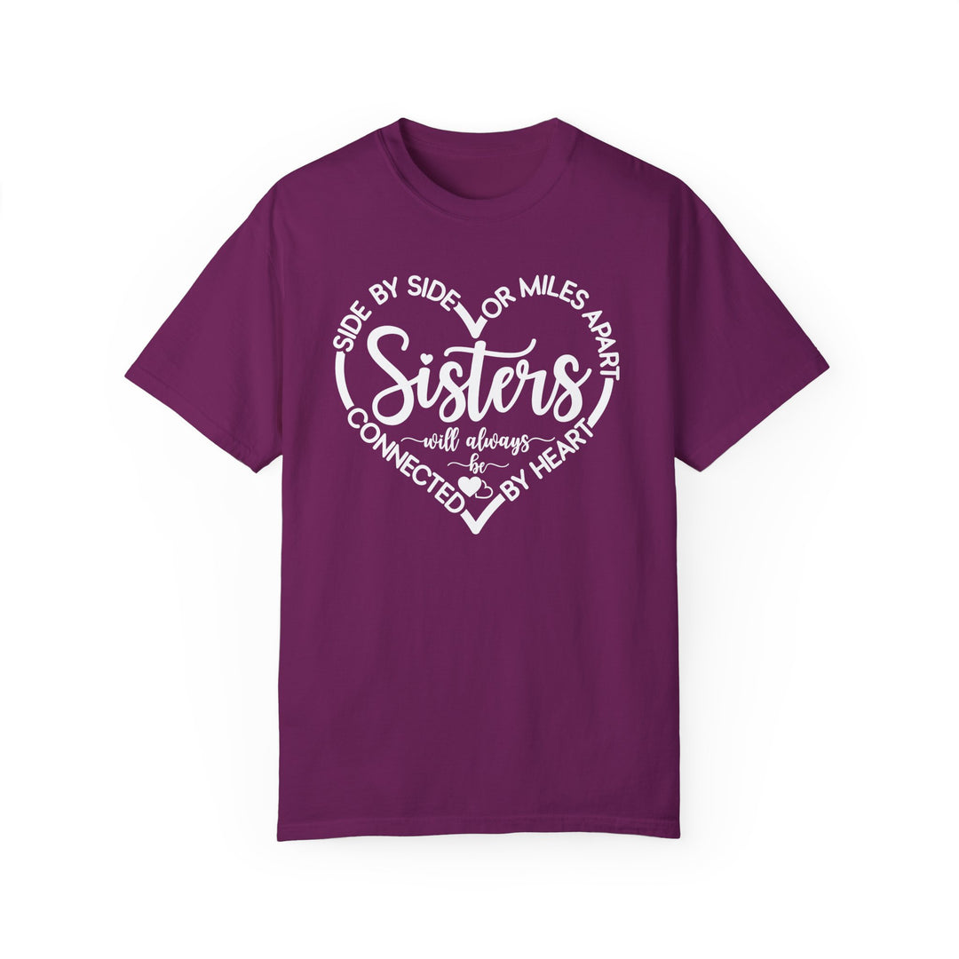 Sisters At Heart Tee, a purple Gildan t-shirt featuring white text, offers a relaxed fit with durable stitching and soft-washed, garment-dyed 100% ring-spun cotton fabric.
