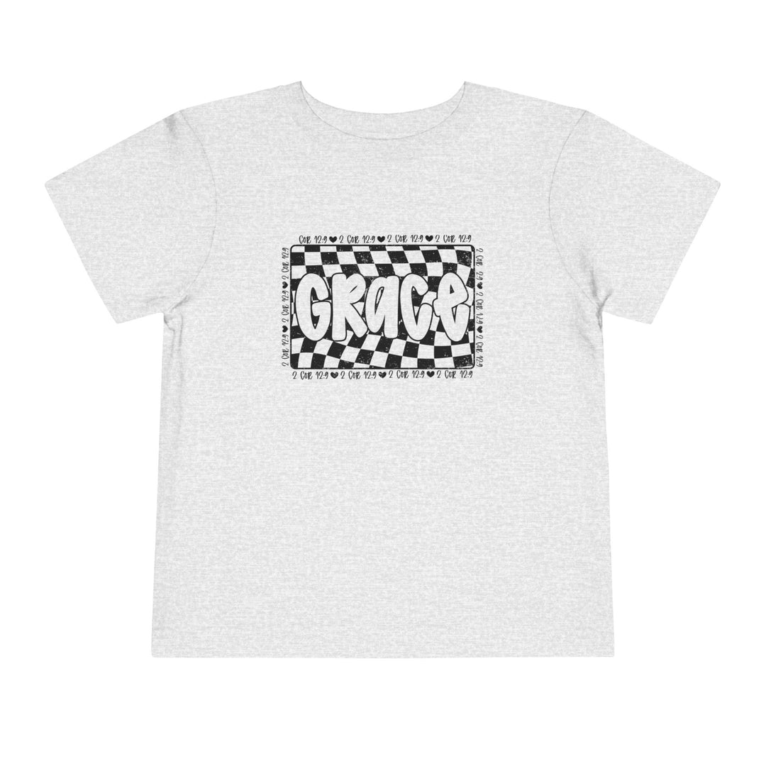 Grace Toddler Tee featuring a black and white checkered design with text, ideal for everyday comfort with its soft, breathable cotton fabric.