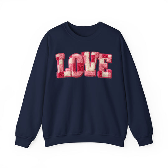 Navy-blue Love Crew sweatshirt with sherpa-textured LOVE in pink and cream, offering comfort and style.