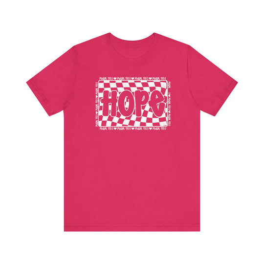 Hope Tee: A pink t-shirt featuring a white and red design, with a classic unisex fit and ribbed knit collars for durability.