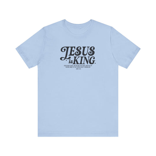 Light blue Jesus is King t-shirt featuring bold black text, crafted from soft cotton with a classic unisex fit and durable ribbed knit collars.