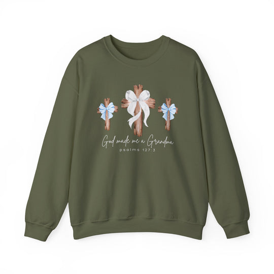 Olive-green crewneck sweatshirt featuring three wooden crosses with bows and script God made me a Grandma with Psalms 127:3 beneath, offering comfort and style.
