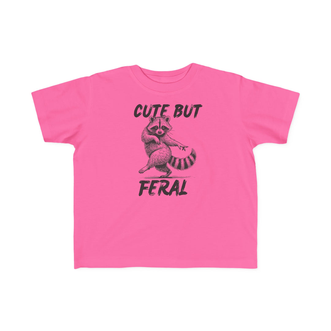 Cute but Feral Toddler Tee featuring a playful raccoon illustration and distressed text, designed for toddler comfort with soft, durable cotton and a classic fit.