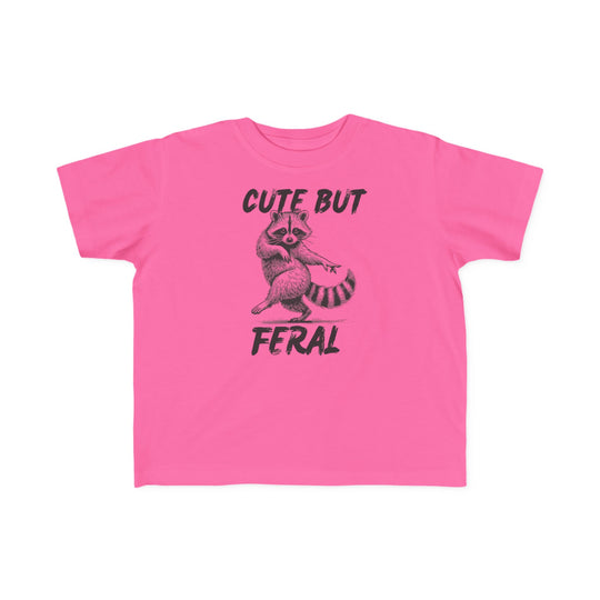 Cute but Feral Toddler Tee featuring a playful raccoon illustration and distressed text, designed for toddler comfort with soft, durable cotton and a classic fit.