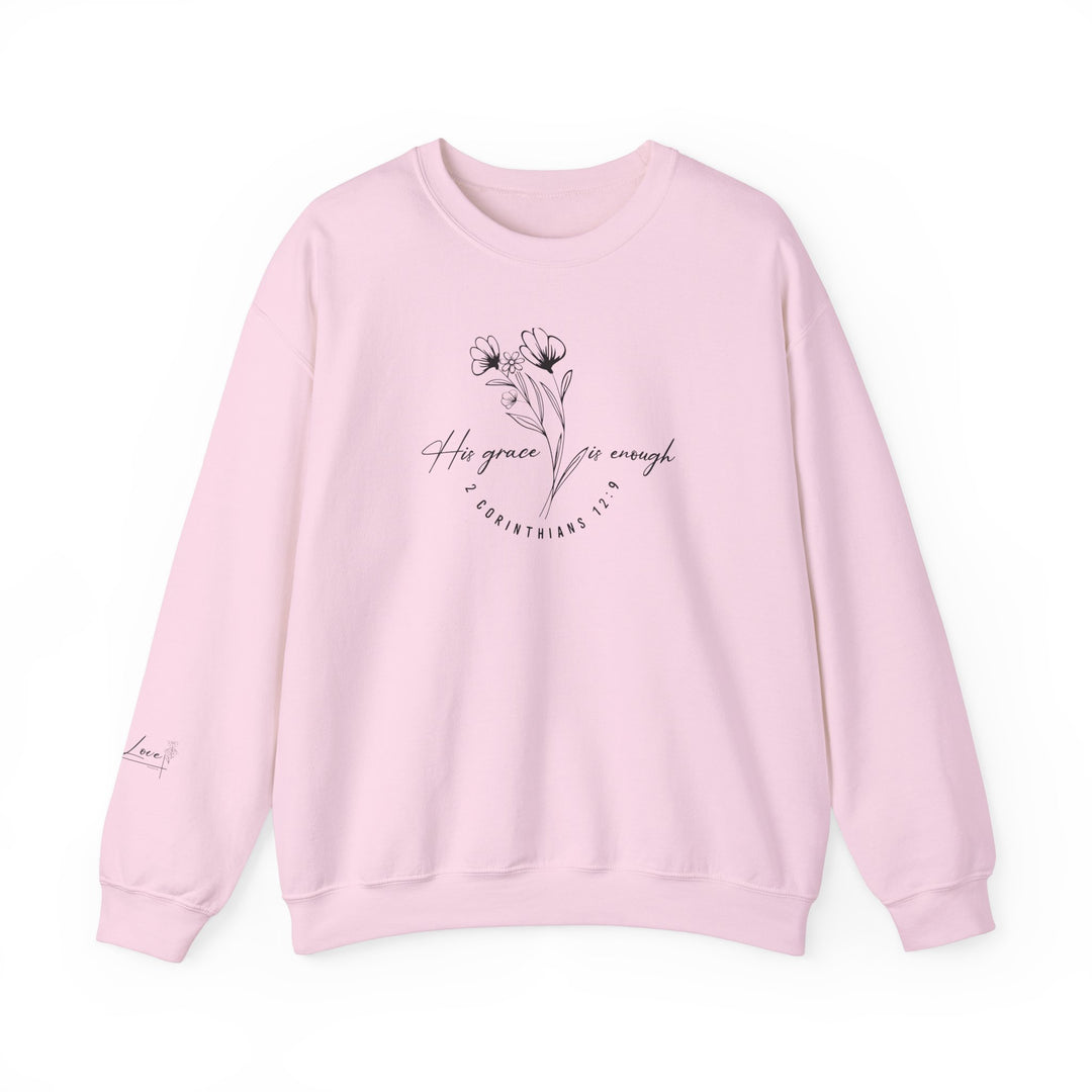 A pink sweatshirt with a flower design, His Grace Is Enough Crew, a cozy unisex heavy blend crewneck sweatshirt made of 50% cotton and 50% polyester. Features ribbed knit collar and double-needle stitching for durability.
