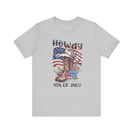 A classic Howdy 4th Tee with cowboy hat, boots, and flowers design on a white t-shirt. Unisex jersey tee made of 100% cotton, featuring ribbed knit collars and taping for durability. Sizes XS to 3XL.