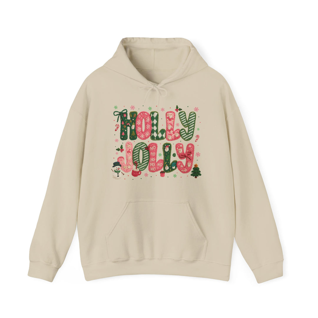 Cream-colored Holly Jolly hoodie with festive candy-cane lettering, snowflakes, snowman, Christmas tree, and Ho Ho Ho accents. Cozy with kangaroo pocket and drawstring hood.