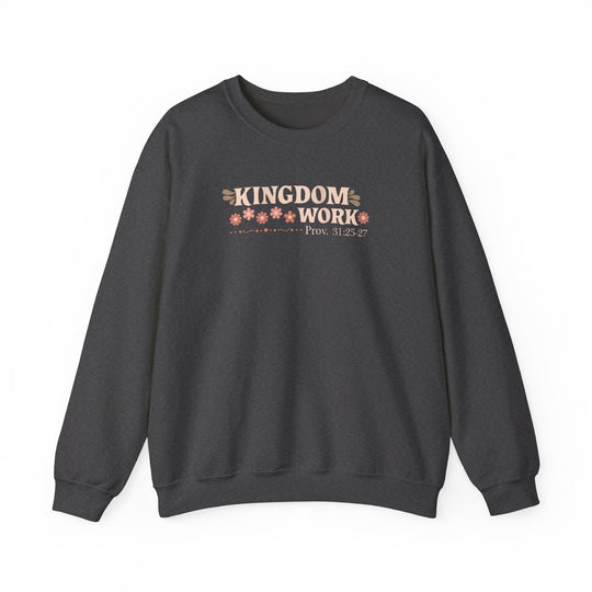 Motherhood Kingdom Work Crew sweatshirt with KINGDOM WORK graphic, pink flowers, and Prov. 31:25-27 citation on charcoal crewneck. Comfortable, polyester-cotton blend, ribbed collar.