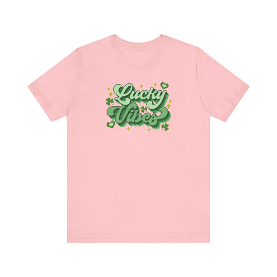 Good Day Lucky Day Tee: Pink jersey short sleeve t-shirt featuring green text. Soft cotton, ribbed knit collar, and dual side seams for lasting shape.