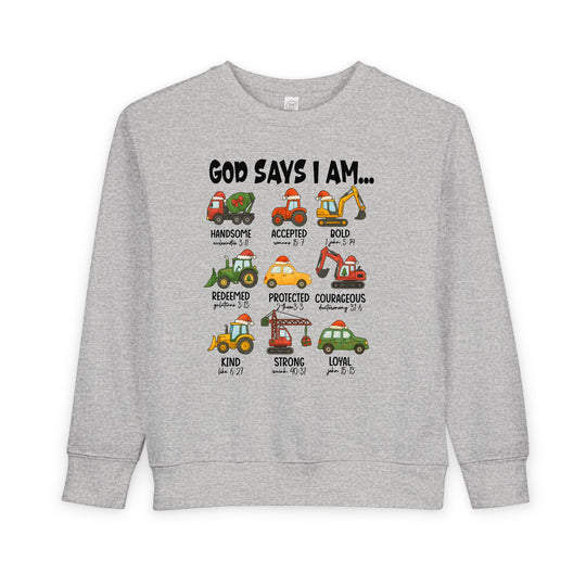 God Says Christmas Truck Toddler Crew: Light-gray sweatshirt featuring Santa-hatted cartoon construction vehicles with positive attributes and Bible references, blending comfort and festive faith.