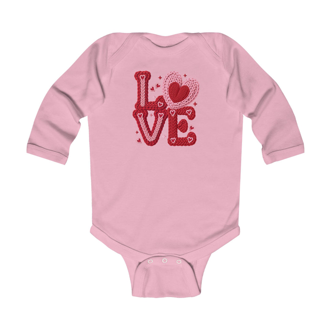 Light-pink Love Heart Onesie with red and pink heart graphic, long sleeves, and snap buttons for easy changing, designed for infant comfort and durability.