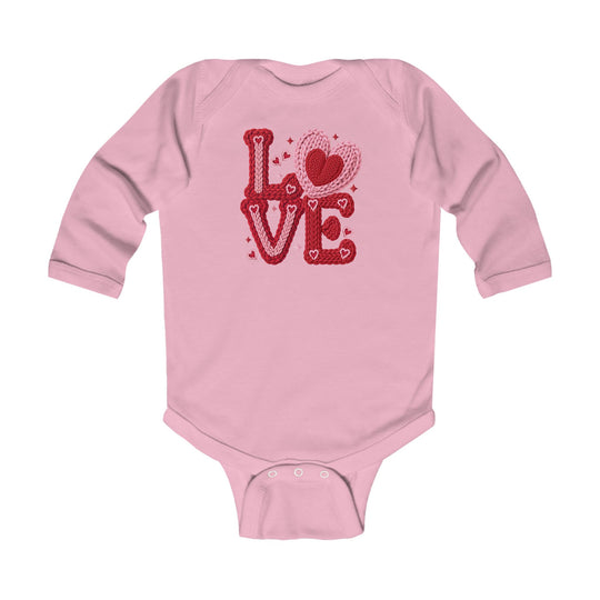 Light-pink Love Heart Onesie with red and pink heart graphic, long sleeves, and snap buttons for easy changing, designed for infant comfort and durability.