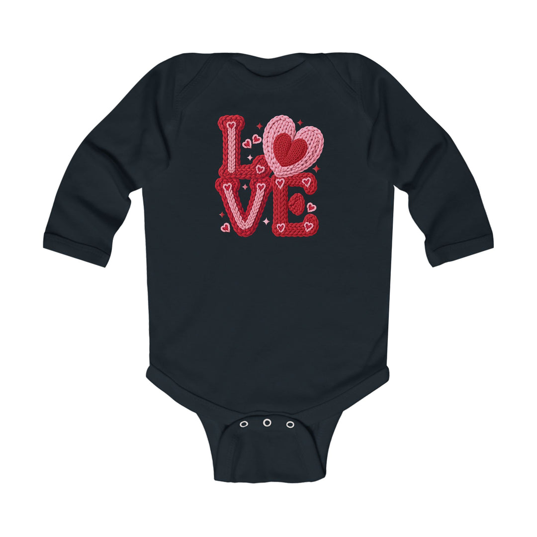 Love Heart Onesie featuring a “LOVE” graphic with heart motifs on a dark, long-sleeved romper, designed for comfort and ease with soft, durable fabric.