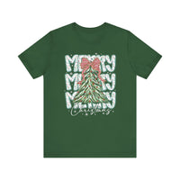 Merry Merry Merry Christmas Tee features a decorated evergreen tree with baubles and bow, surrounded by festive text and snowflakes on a soft, unisex green shirt.