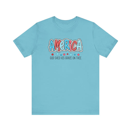 A classic unisex jersey tee featuring God Shed His Grace on Thee text. Made of 100% cotton, ribbed knit collars, and tear-away label. Retail fit, runs true to size. Ideal for everyday wear.