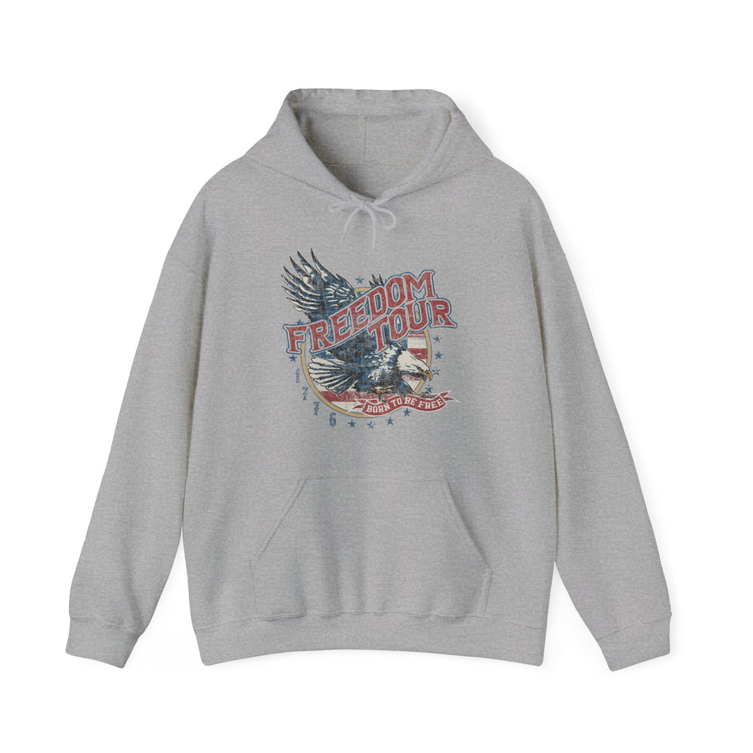 A grey Freedom Tour Hoodie, a blend of cotton and polyester, featuring a graphic design. Unisex, heavy fabric, kangaroo pocket, and drawstring hood. Comfortable, warm, and ideal for printing.