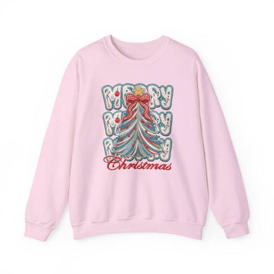 Light-pink crewneck sweatshirt featuring a stylized Christmas tree with a red bow and ornaments, and Merry Christmas text. Cozy, unisex design for colder months.