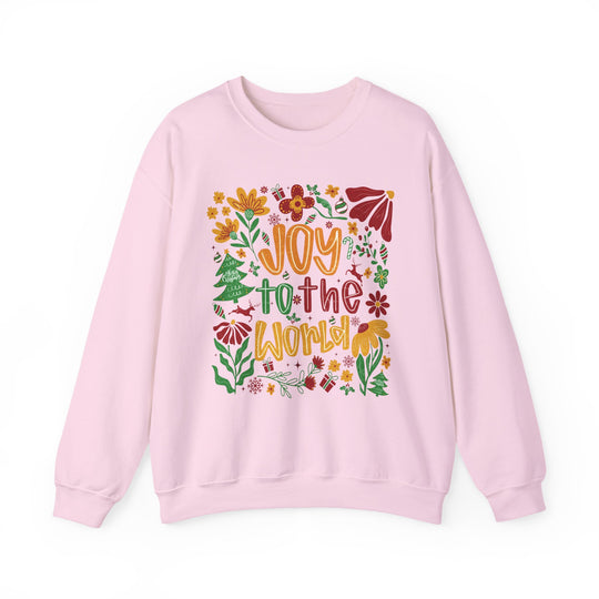 Light pink Joy to the World crewneck sweatshirt with festive illustrations, including flowers and reindeer, ideal for cozy, stylish winter wear.