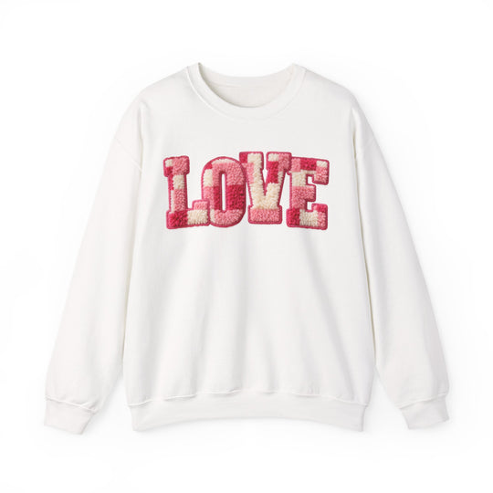 White Love Crew sweatshirt with plush chenille LOVE letters in pink and cream, reflecting Faith Family Designs' cozy, trendy style.