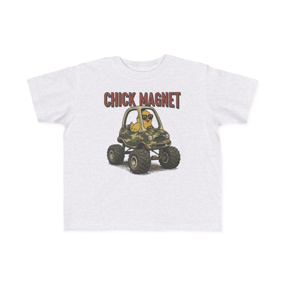 Chick Magnet Toddler Tee featuring a cartoon chick in sunglasses driving a camouflage monster truck, perfect for toddlers with its soft, durable cotton fabric.