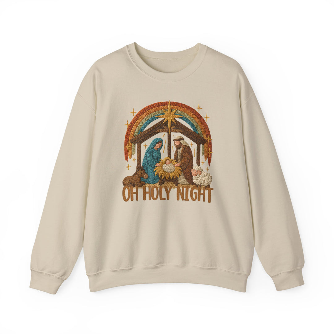 Cream-colored sweatshirt featuring an embroidered-style nativity scene with OH HOLY NIGHT text. Comfortable, durable, and ideal for cold months.