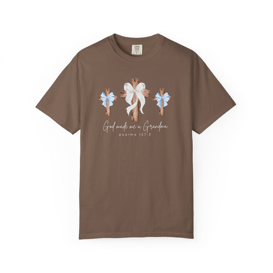 Brown crew-neck tee with three rustic crosses and bows, featuring the phrase “God made me a Grandma” and “Psalms 127:3.” Made from soft, durable cotton.