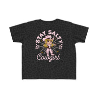 Salty Cowgirl Tee for toddlers, featuring a cartoon girl in a cowboy hat pointing, on a black, soft cotton t-shirt. Perfect for sensitive skin.