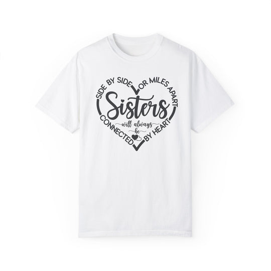 Sisters At Heart Tee: A white t-shirt featuring bold black text, crafted from 100% ring-spun cotton for comfort and durability, ideal for daily wear.