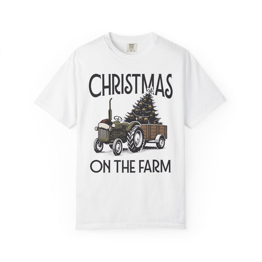 White T-shirt featuring a festive farm scene with a Santa-hat-topped tractor and Christmas tree, captioned CHRISTMAS ON THE FARM, offering a cozy, relaxed fit.