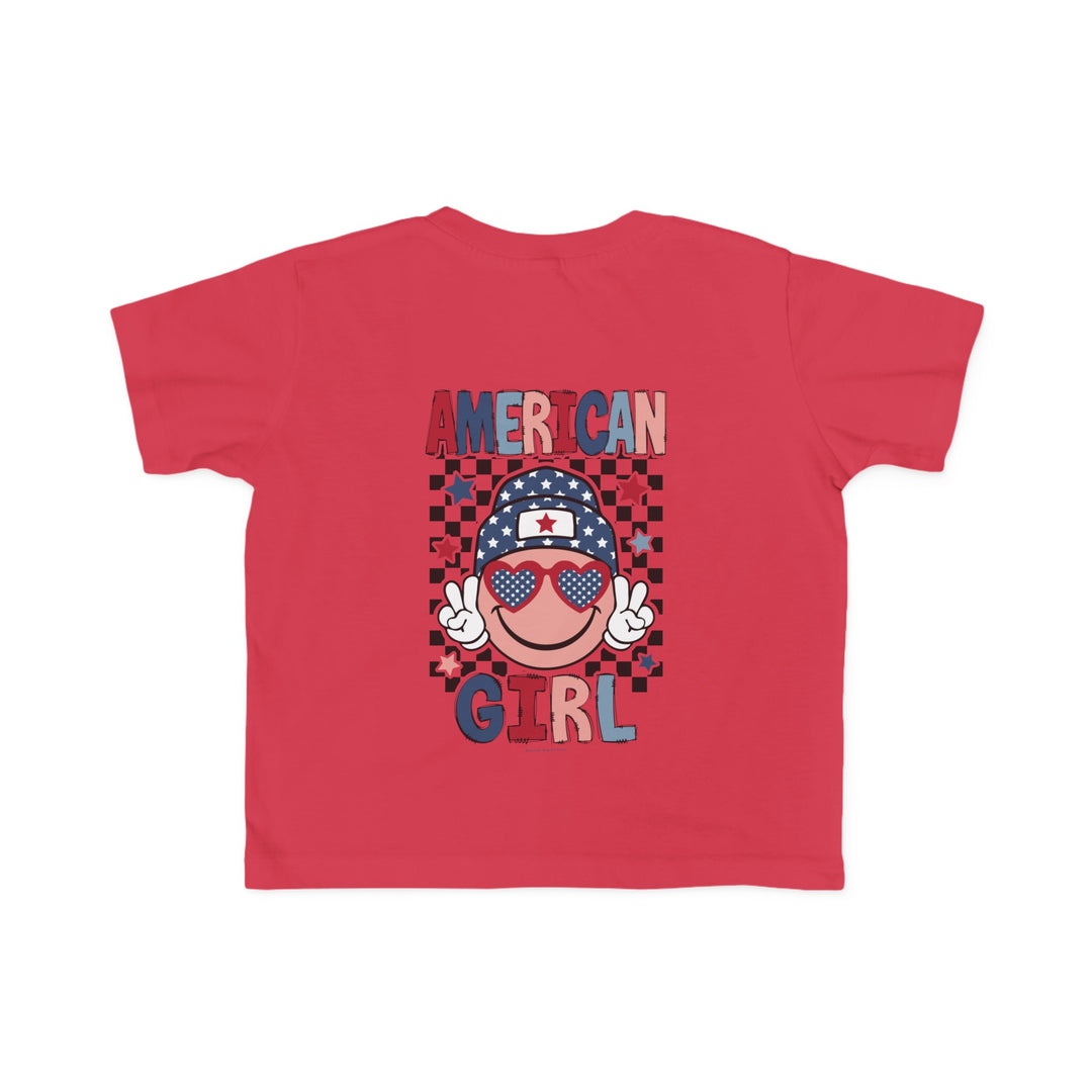 American Girl Toddler Tee featuring a red shirt with a cartoon face, sunglasses, and hat. Soft 100% combed ringspun cotton, light fabric, classic fit, tear-away label. Sizes: 2T, 3T, 4T, 5-6T.