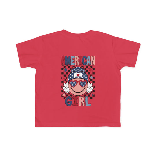 American Girl Toddler Tee featuring a red shirt with a cartoon face, sunglasses, and hat. Soft 100% combed ringspun cotton, light fabric, classic fit, tear-away label. Sizes: 2T, 3T, 4T, 5-6T.