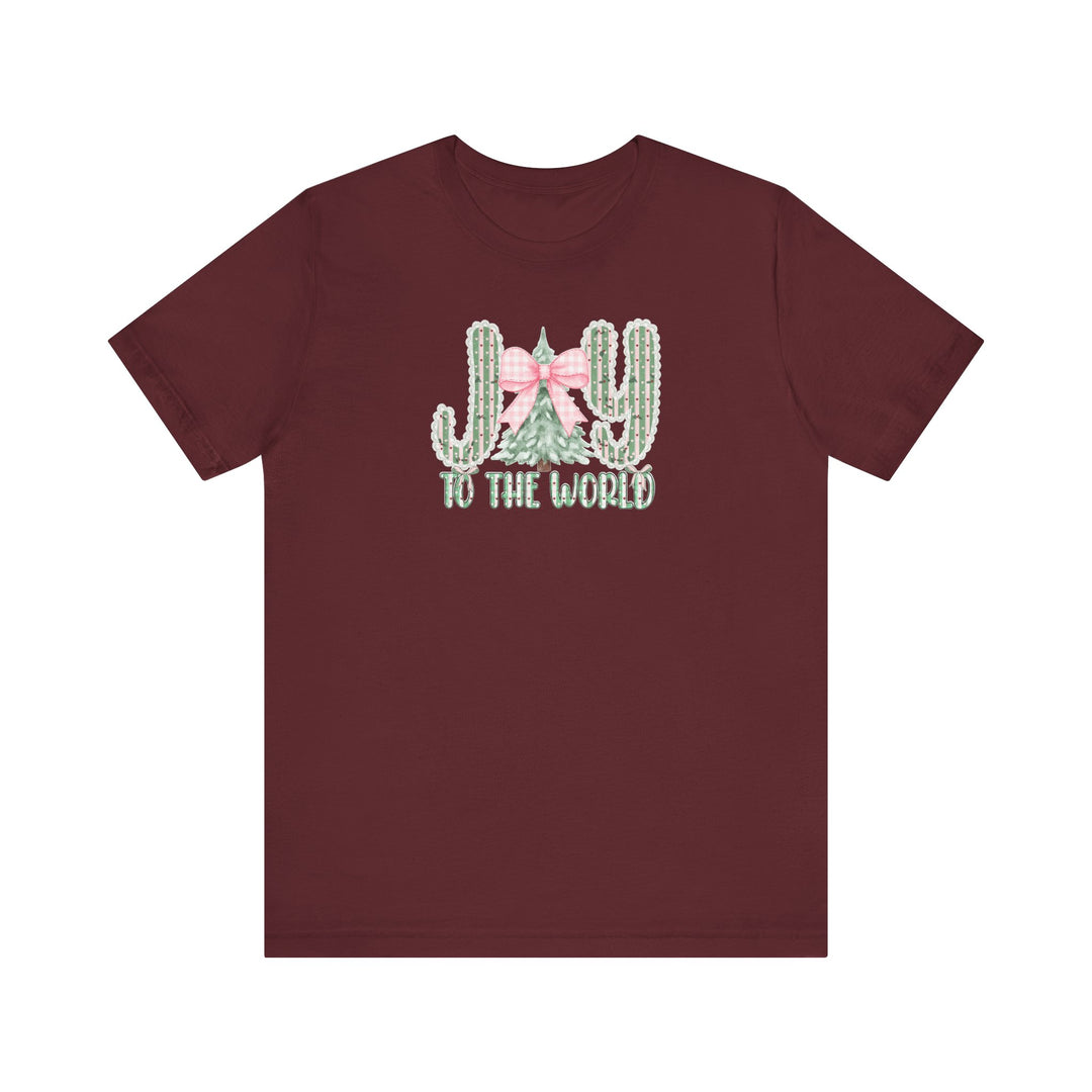 Joy to the World Tee with desert and Christmas motif design featuring cacti letters and an evergreen tree, crafted from soft cotton for a comfortable fit.