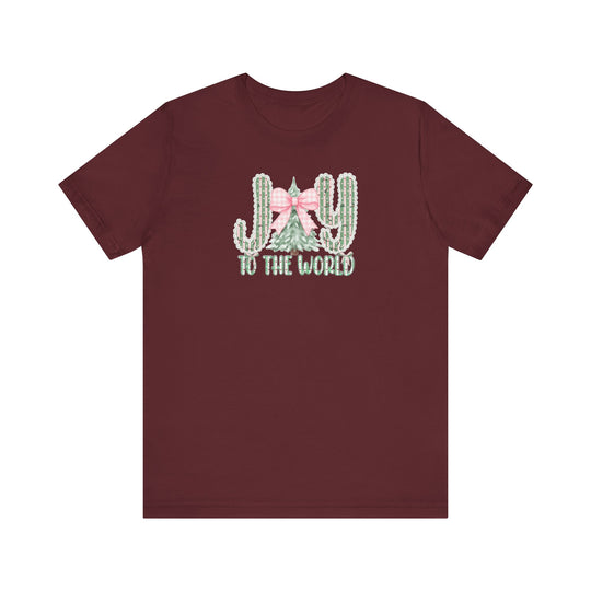 Joy to the World Tee with desert and Christmas motif design featuring cacti letters and an evergreen tree, crafted from soft cotton for a comfortable fit.
