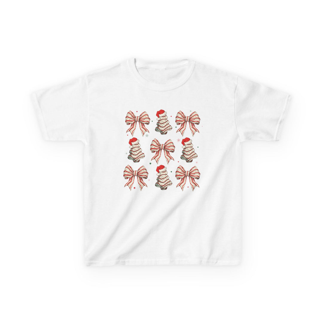 Cookies and Bows Kids Tee featuring a grid of festive icons: red-and-white bows and stylized Christmas trees with Santa hats on a plain white T-shirt.