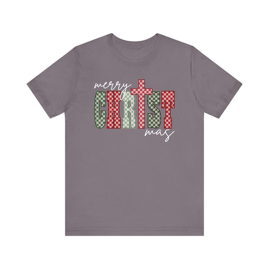 Christmas Tee with merry CHRISTmas design in festive checkerboard patterns on a soft, gray/purple short-sleeved shirt, featuring a cross-stylized T.
